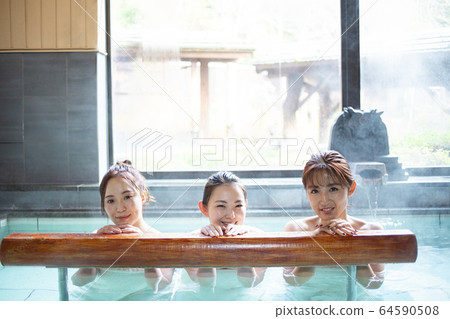 Women and friends enjoying an open-air bath Women and friends enjoying an open-air bath 64590508