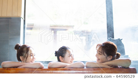 Women and friends enjoying an open-air bath Women and friends enjoying an open-air bath 64590529