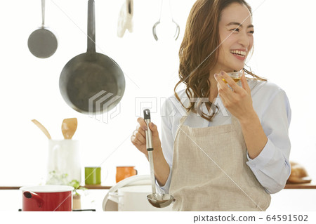 Woman cooking Woman cooking 64591502