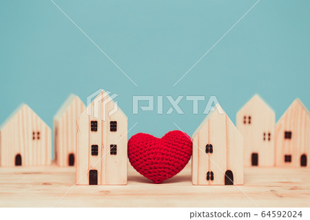 Love heart between two house wood model for stay at home for healthy community together 64592024