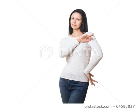 Tall caucasian attractive adult woman with long dark hair in jeans and pullover, casual style. Typical model, posing in studio, isolated on white Tall caucasian attractive adult woman with long dark hair in jeans and pullover, casual style. Typical model, posing in studio, isolated on white 64593837