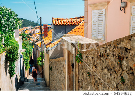Narrow stairway to the old town in Dubrovnik, Croatia 64594632