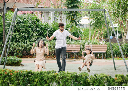 Family spending time in park 64595255