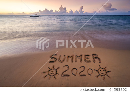 Handwritten Summer 2020 on sandy beach Handwritten Summer 2020 on sandy beach 64595802