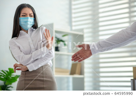 Young woman in a protective mask looking nervous Young woman in a protective mask looking nervous 64595990