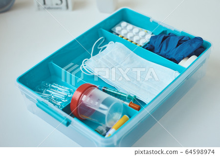 First aid kit  close up. Home medicine box with a 64598974