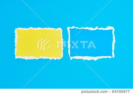 Two ripped paper torn edge sheets on a blue Two ripped paper torn edge sheets on a blue 64598977