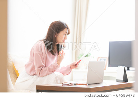 A woman confirming a document 64599478