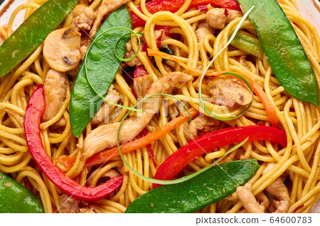 Chicken Lo Mein Noodles close up. Lo Mein is Chinese cuisine dish Chicken Lo Mein Noodles close up. Lo Mein is Chinese cuisine dish 64600783
