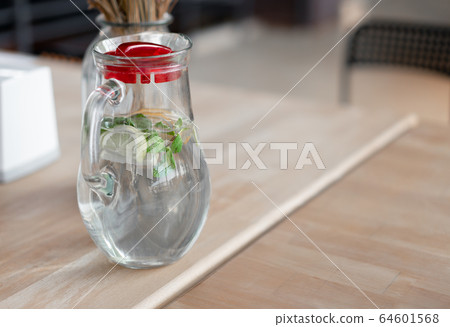 Healthy food and drinks. Water in glass mug with 64601568
