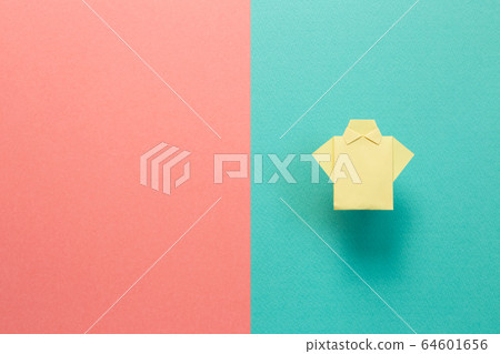 Yellow paper shirt origami on green pink background Yellow paper shirt origami on green pink background 64601656