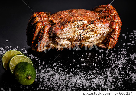 Sea delicacy. Tasty red crab with lime and spice 64603234