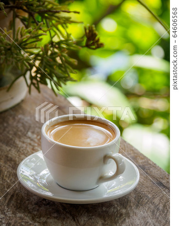 Hot coffee americano on the old wooden table 64606568