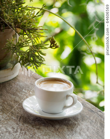Hot coffee americano on the old wooden table Hot coffee americano on the old wooden table 64606569