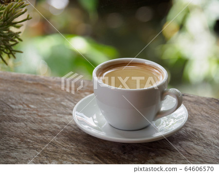 Hot coffee americano on the old wooden table Hot coffee americano on the old wooden table 64606570