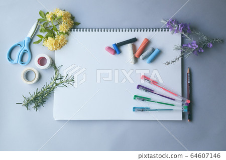 Little hand of a child drawing on a drawing paper 64607146