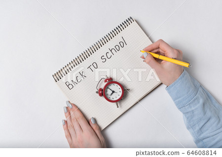 Inscription in notebook BACK TO SCHOOL. Female Inscription in notebook BACK TO SCHOOL. Female 64608814