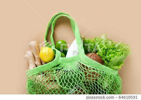 Zero waste. Healthy vegan goods, mesh bag, ginger. Zero waste. Healthy vegan goods, mesh bag, ginger. 64610591