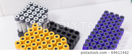 Many test tubes with blood being tested. Coronavirus and covid-19 concept. 64611482