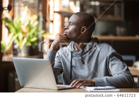Thoughtful african american businessman lost in thoughts search for inspiration Thoughtful african american businessman lost in thoughts search for inspiration 64611723