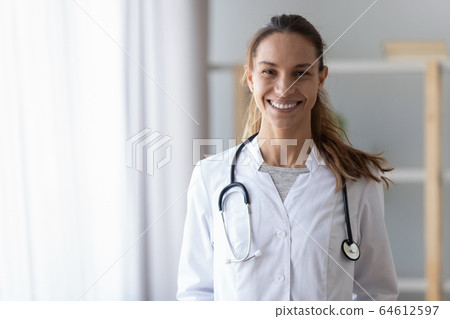 Smiling young female doctor wear medical uniform with stethoscope, portrait Smiling young female doctor wear medical uniform with stethoscope, portrait 64612597