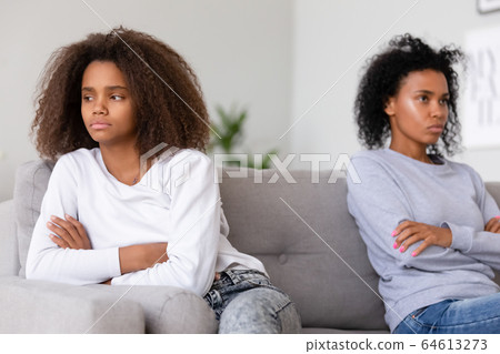 Stubborn african american teen daughter ignoring angry annoyed mom 64613273