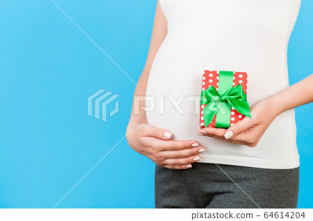 Close up of pregnant woman in home clothing Close up of pregnant woman in home clothing 64614204