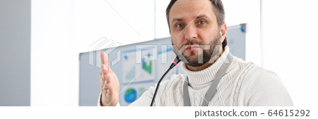 Serious concentrated male employee Serious concentrated male employee 64615292