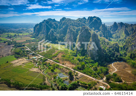 Aerial view of Limestone mountain and rice field Aerial view of Limestone mountain and rice field 64615414