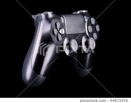 Black video game joystick gamepad isolated on a black background 64615816