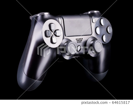 Black video game joystick gamepad isolated on a black background Black video game joystick gamepad isolated on a black background 64615817
