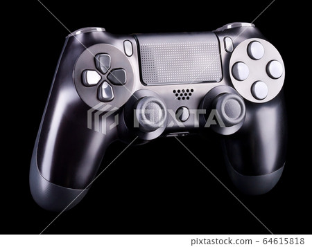 Black video game joystick gamepad isolated on a black background Black video game joystick gamepad isolated on a black background 64615818