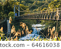 Waterfall and bridge 64616038