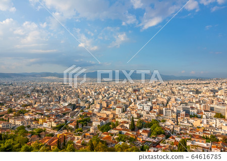 Blue Sky With Clouds Over the Roofs of Athens 64616785