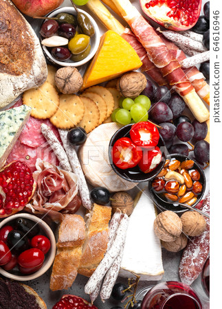 Mix of snacks and appetizers 64616946