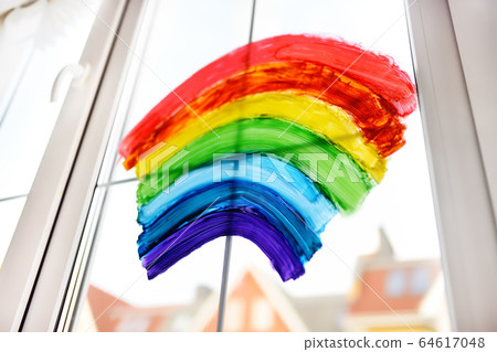Drawing of rainbow on home window while quarantine Drawing of rainbow on home window while quarantine 64617048