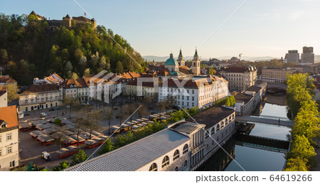 Aerial drone panoramic view of Ljubljana medieval city center, capital of Slovenia in warm afternoon sun. Empty streets during corona virus pandemic social distancing measures 64619266