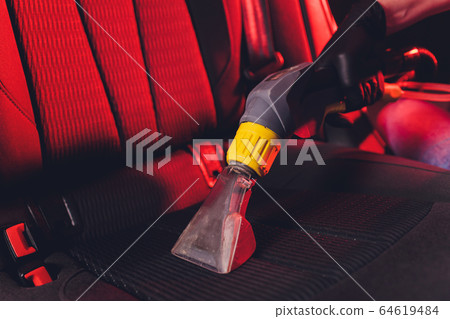 Car interior textile seats chemical cleaning with professionally extraction method. Early spring cleaning or regular clean up. Car interior textile seats chemical cleaning with professionally extraction method. Early spring cleaning or regular clean up. 64619484
