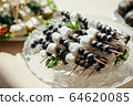 Catering, buffet at the event with various snacks. 64620085