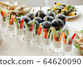 Catering, buffet at the event with various snacks. 64620090