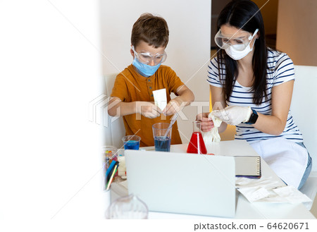 Young brunette female person wearing rubber gloves Young brunette female person wearing rubber gloves 64620671