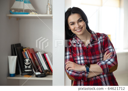 Happy young woman spending good time at home Happy young woman spending good time at home 64621712