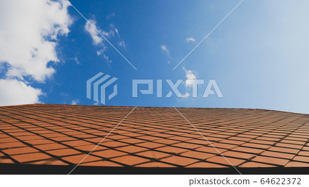 Roof on blue sky background.Concrete ceramic Roof on blue sky background.Concrete ceramic 64622372