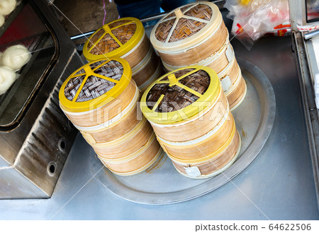 Salapao or pork steamed bun served in the basket. Salapao or pork steamed bun served in the basket. 64622506