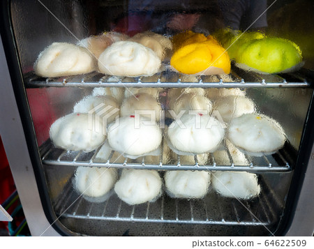 Salapao or pork steamed bun served in the basket. Salapao or pork steamed bun served in the basket. 64622509