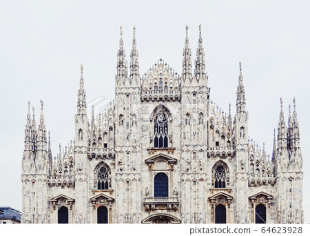 Milan Cathedral known as Duomo di Milano, historical building and famous landmark in Lombardy region in Northern Italy Milan Cathedral known as Duomo di Milano, historical building and famous landmark in Lombardy region in Northern Italy 64623928