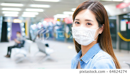 woman with mask in mrt woman with mask in mrt 64624274
