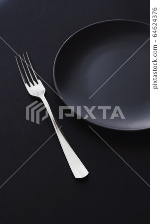 Empty plates and silverware on black background, premium tableware for holiday dinner, minimalistic design and diet Empty plates and silverware on black background, premium tableware for holiday dinner, minimalistic design and diet 64624376