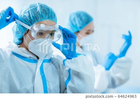 doctors wear protective suits 64624963