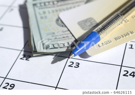 Pen and credit card on many hundred US dollar 64626115